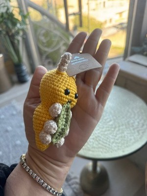 This handmade keychain is carefully crocheted from soft wool yarn and designed i