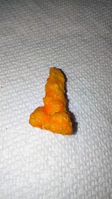 weird shaped food, hot cheeto, around 1 inch, weirdly shaped with a strange tip 
