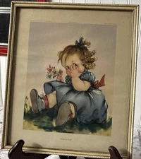 A framed "Peek-a-Boo" print by Anne Allaben, published by Edward Gross Co.