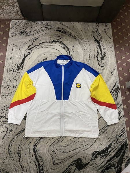 Top cortavientos Lidl Crivit Shell azul blanco amarillo nuevo con etiquetas talla XL para hombre’s