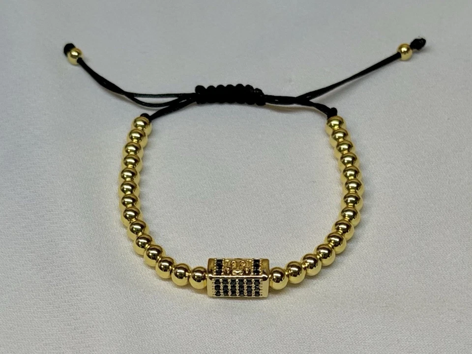 Pulsera unisex oro laminado 18k con dije rectangular negro Foto 2 de 3
