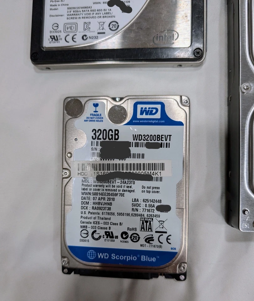 Lot 4 Hard Drives-Intel SSD 60GB, WD Scorpio 320GB, 2x WD Blue 1TB (1 noisy) - Image 4 of 4