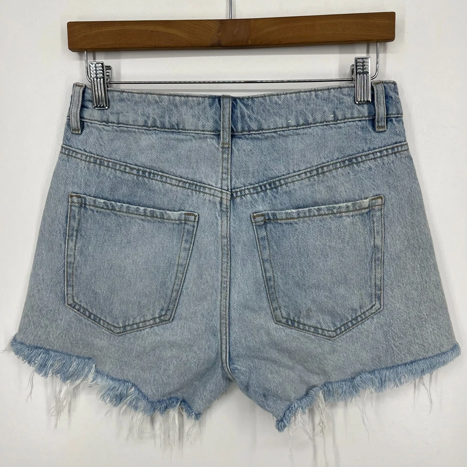 Pantalones cortos de mezclilla Garage para mujer talla 26 azul corte festival desgastado lavado claro Foto 4 de 4