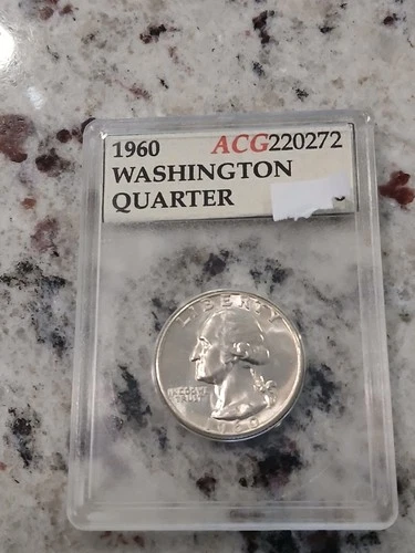 1960 Uncirculated Washington Quarter in an old holder