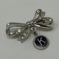 Kiwanis Bow Pin Silver Tone with Rhinestones and Blue Logo