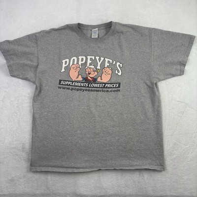 VTG 2010 M&O Knits Popeye's Supplements Grey SS Graphic Shirt Men's XL Stains