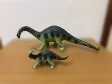 Safari: Baby Apatosaurus and two adult Apatosaurus dinosaurs