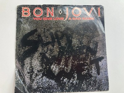 Bon Jovi Lay Your Hands on Me / You Give Love 45 vinyl record with sleeve