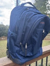 JanSport Navy Rolling Backpack and Travel Bag Carry On with Wheels Driver 8