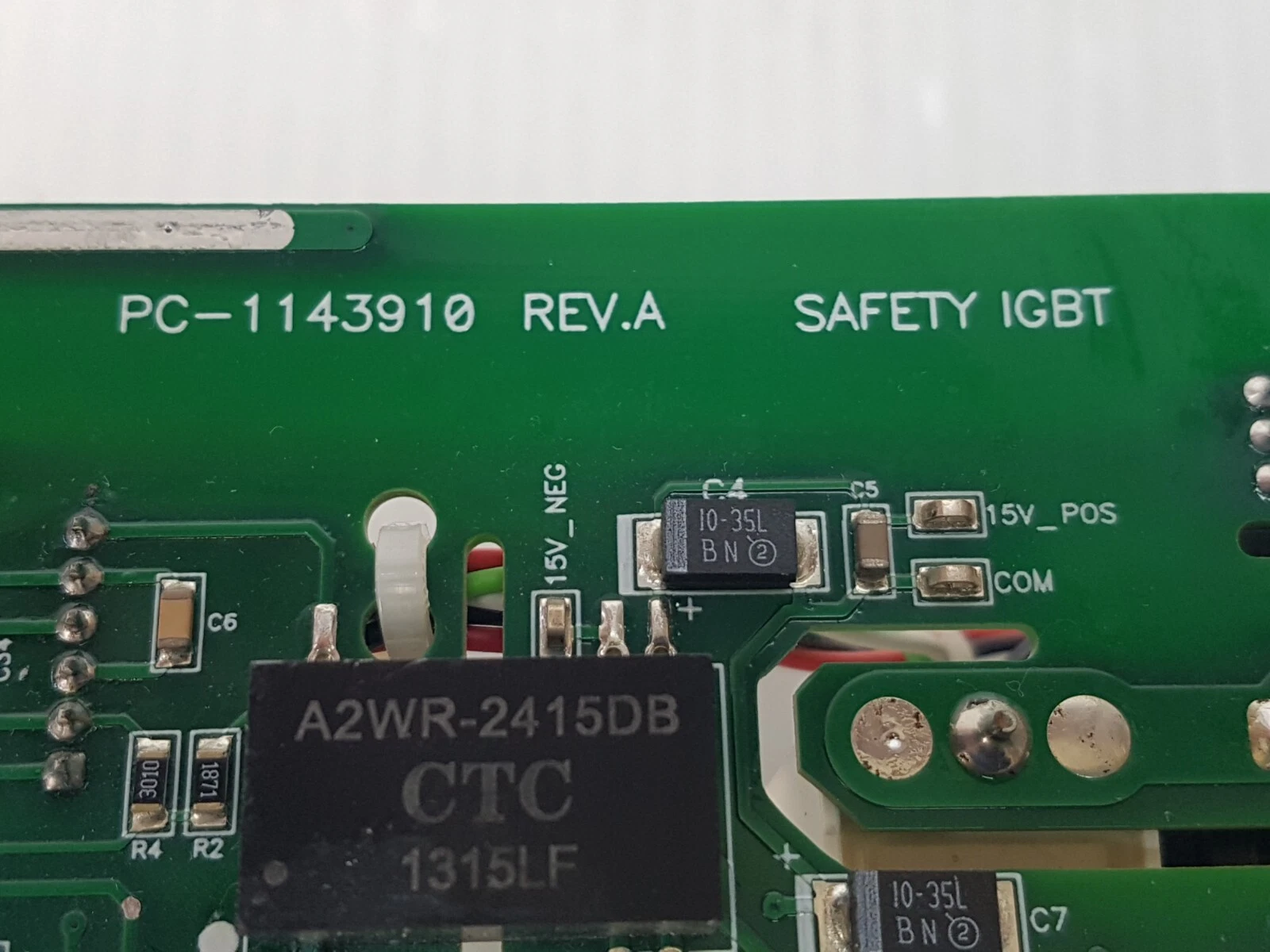 Close-up of PC-1143910 REV.A SAFETY IGBT silkscreen and CTC A2WR-2415DB module