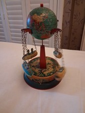Vintage Roundabout Tin Toy