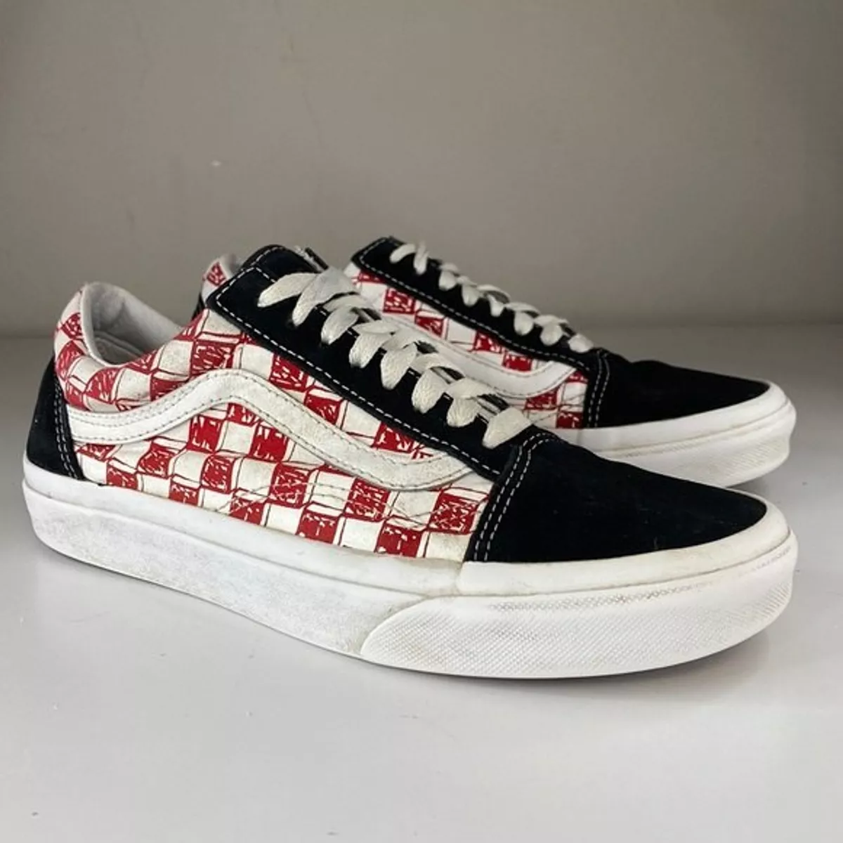 Old skool red shop and black checkerboard vans