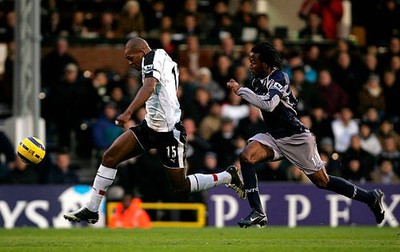 Collins John of Fulham sprints away from Ricardo Gardner of Bolton- 2005 Photo