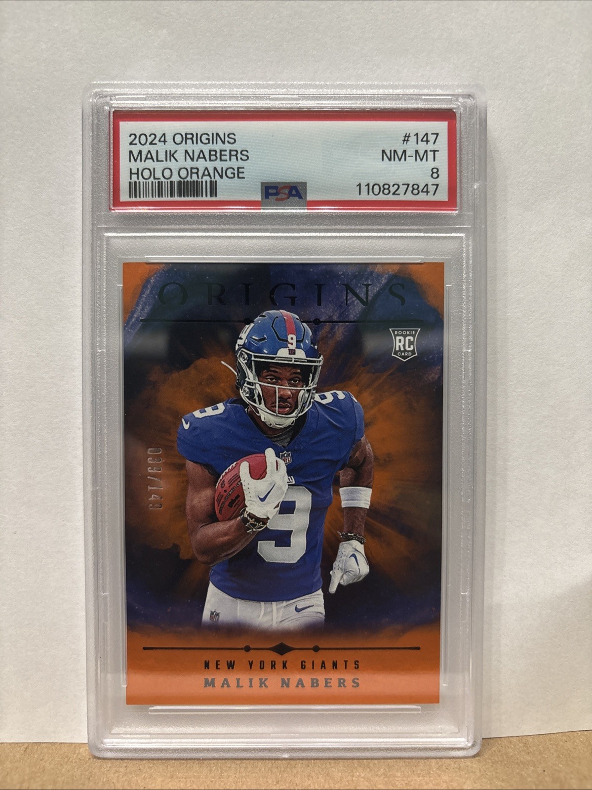 2024 Panini Origins - Rookies Malik Nabers #147 Holo Orange /149 (RC)
