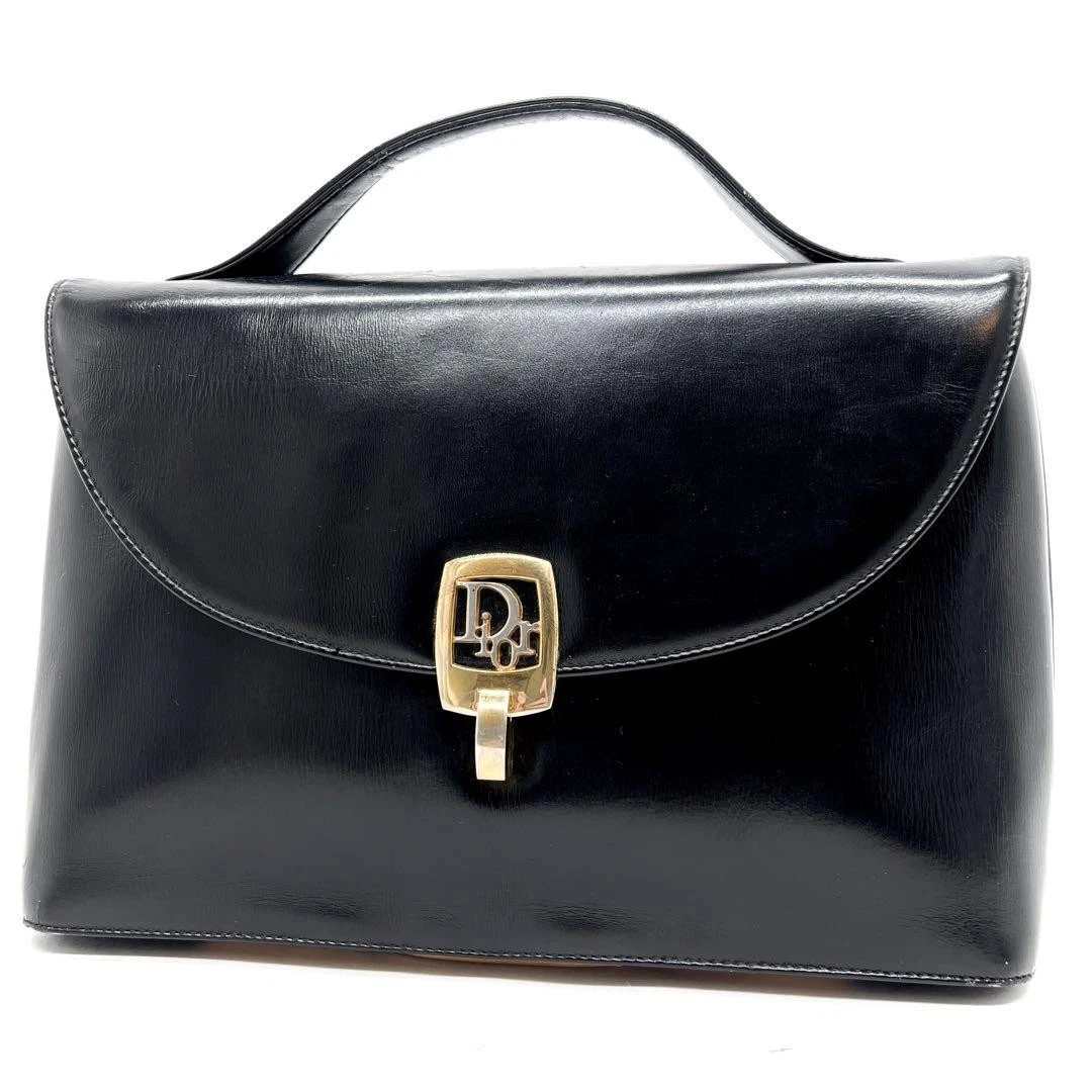Sac à main Dior quincaillerie dorée cuir de veau noir bel état