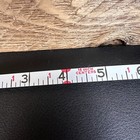 Vintage Stanley 50 foot hand crank tape measure with black and white label, 16 inch centers, and red vertical scale.