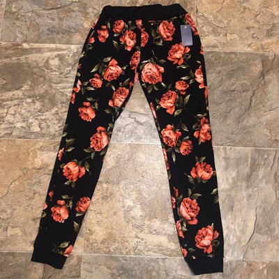black jeans with red roses
