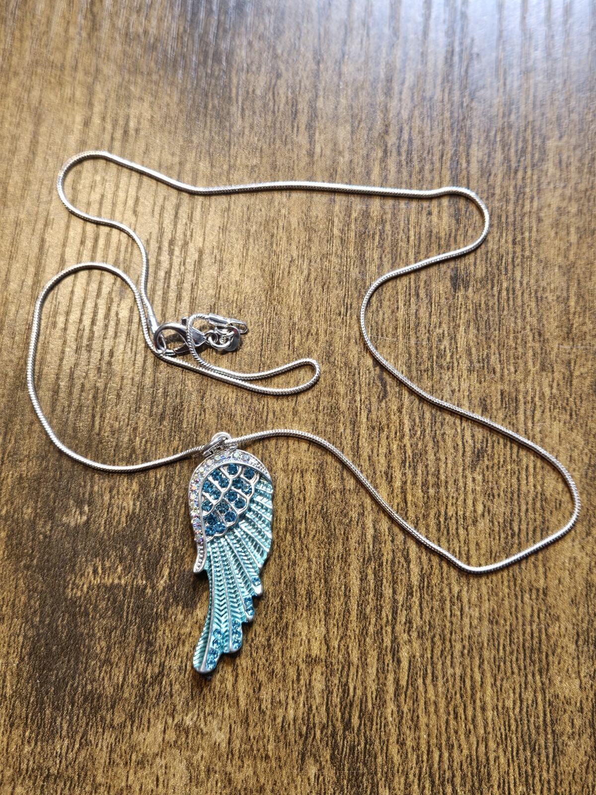Teal Angel Wing Feather Pendant on 20