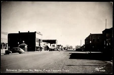 Postcard  Business Section, Looking East, Del Norte, CO  RPPC