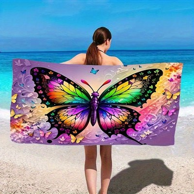 A Vibrant Beach Towel Featuring a Butterfly And Flower Design, Made from Quick