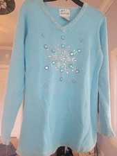 Light blue knitted sweater with snowflakes beads