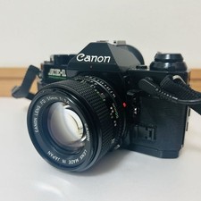 Canon AE-1 Program fotocamera pellicola 35 mm obiettivo NFD 50 mm f/1.4 usato