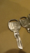 OEM # 1154607 GM GENUINE OEM new TRUNK DOOR KEY BLANK with gm MONIKER 2 PIECES