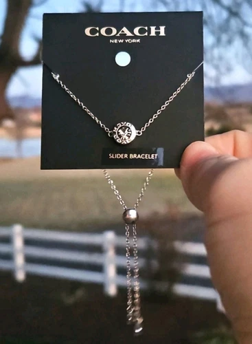 BRACCIALE COACH REGOLABILE SLIDER MSRP $78 NUOVO argento