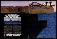 1986 Chrysler LeBaron GTS vs. BMW 528e Aircraft Carrier Vintage 2-Page Print Ad