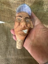 Bouchon à vin en bois sculpté