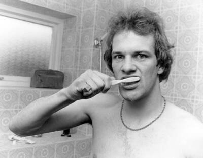 Aston Villa and Scotland footballer Andy Gray cleaning his teeth i- Old Photo