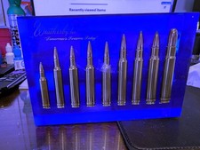 Weatherby 9 Cartridge in a Blue Lucite Display Block