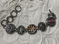 Ginger Snaps silvertone bracelet with three d...
