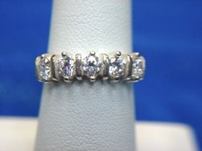 STERLING SILVER RING WITH 5 SPARKLY SET STONES - NICE