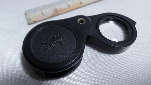 Lupa de vidrio rusa d vintage KOMZ 7x lente lupa baquelita plegable X7 3399 - Imagen 1 de 6