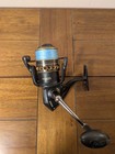 Penn Battle II 5000 Saltwater Fishing Spinning Reel Blk Gld W/Blue Braided Line — photo 1