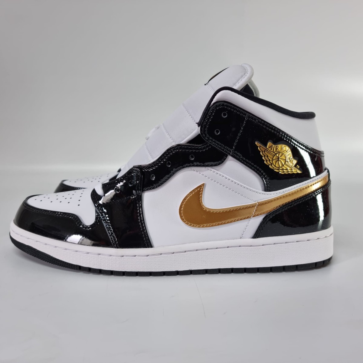 gold white black jordans