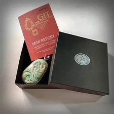 Burmese jade pendant carved in 92.5 sterling silver with African rubies