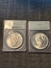 1923 LIBERTY PEACE DOOLAR MS 64 AND MS 63 2 COIN LOT IN RATTLER HOLDERS