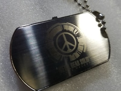 Dog Tag METAL GEAR SOLID Peacewalker - Catalogo | A Loja dos