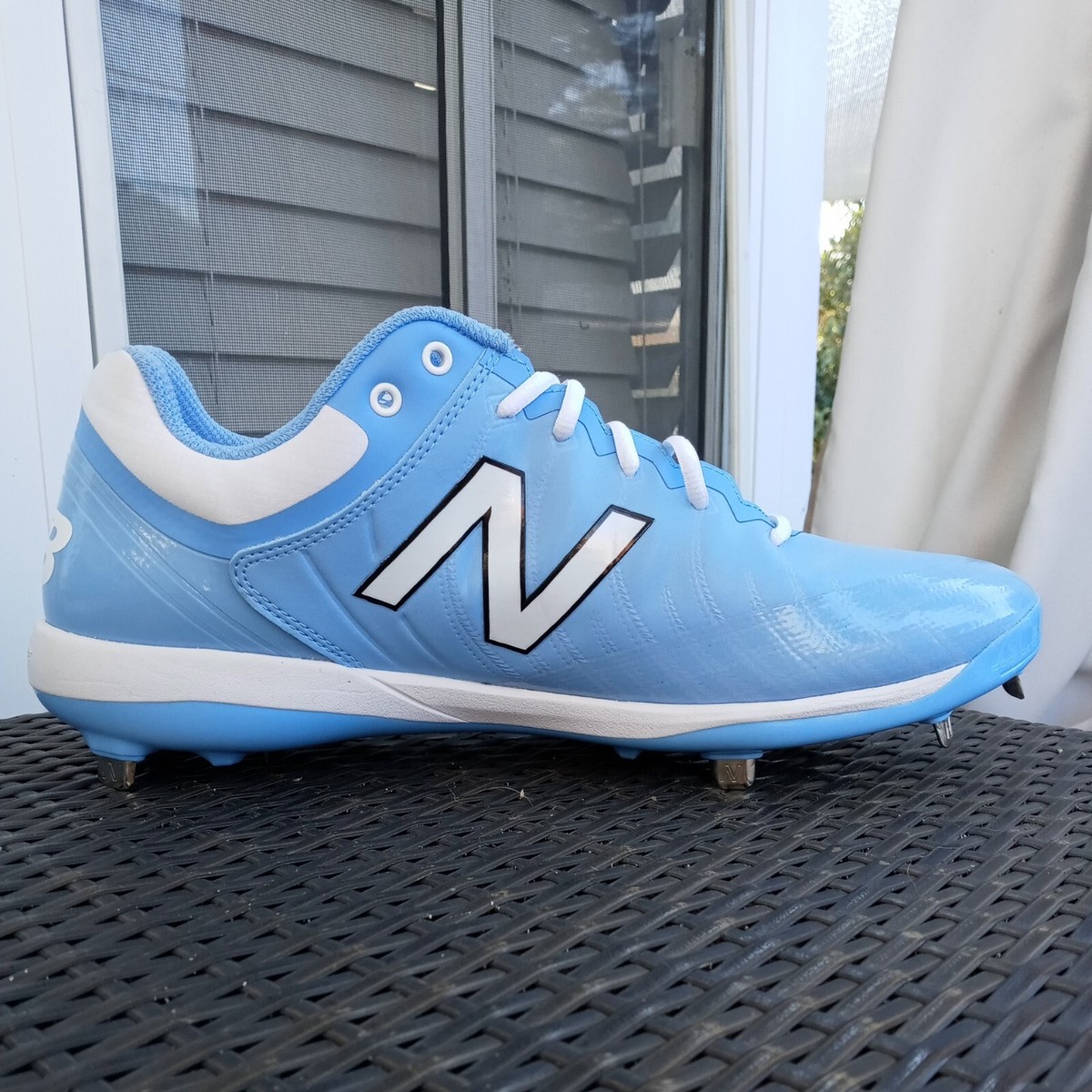 new balance light blue cleats