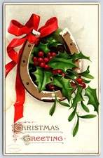 Postcard Merry Christmas Horseshoe Ribbon Holly Clapsaddle c1908 AP7