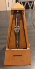metronome in working condition decorative wood looks nice on piano 40 years old