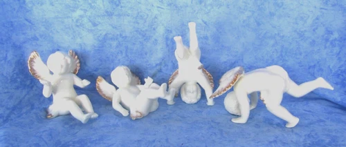 Playing Angels, Set of 4 Porcelain Tumbling Angels by Centurion Collection NIB