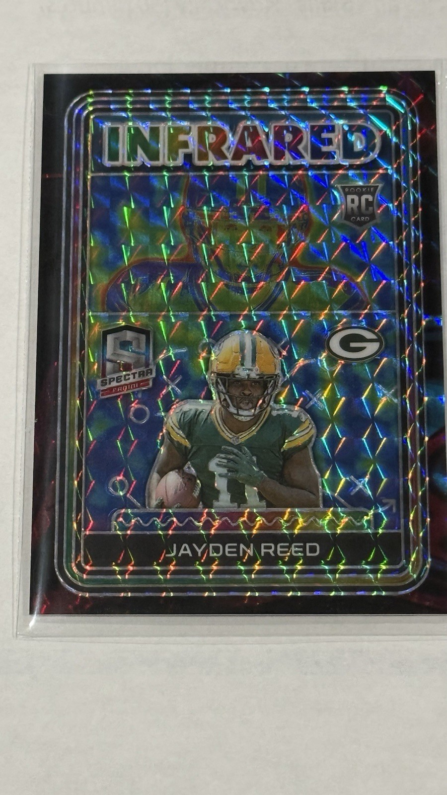 2023 Spectra Jayden Reed RC Infrared Interstellar Prizm 34/50 Packers