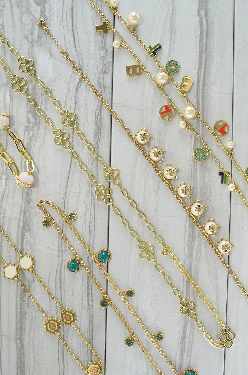 Collana con ciondolo tono oro catena lunga logo Tory Burch nuova scegli un disegno