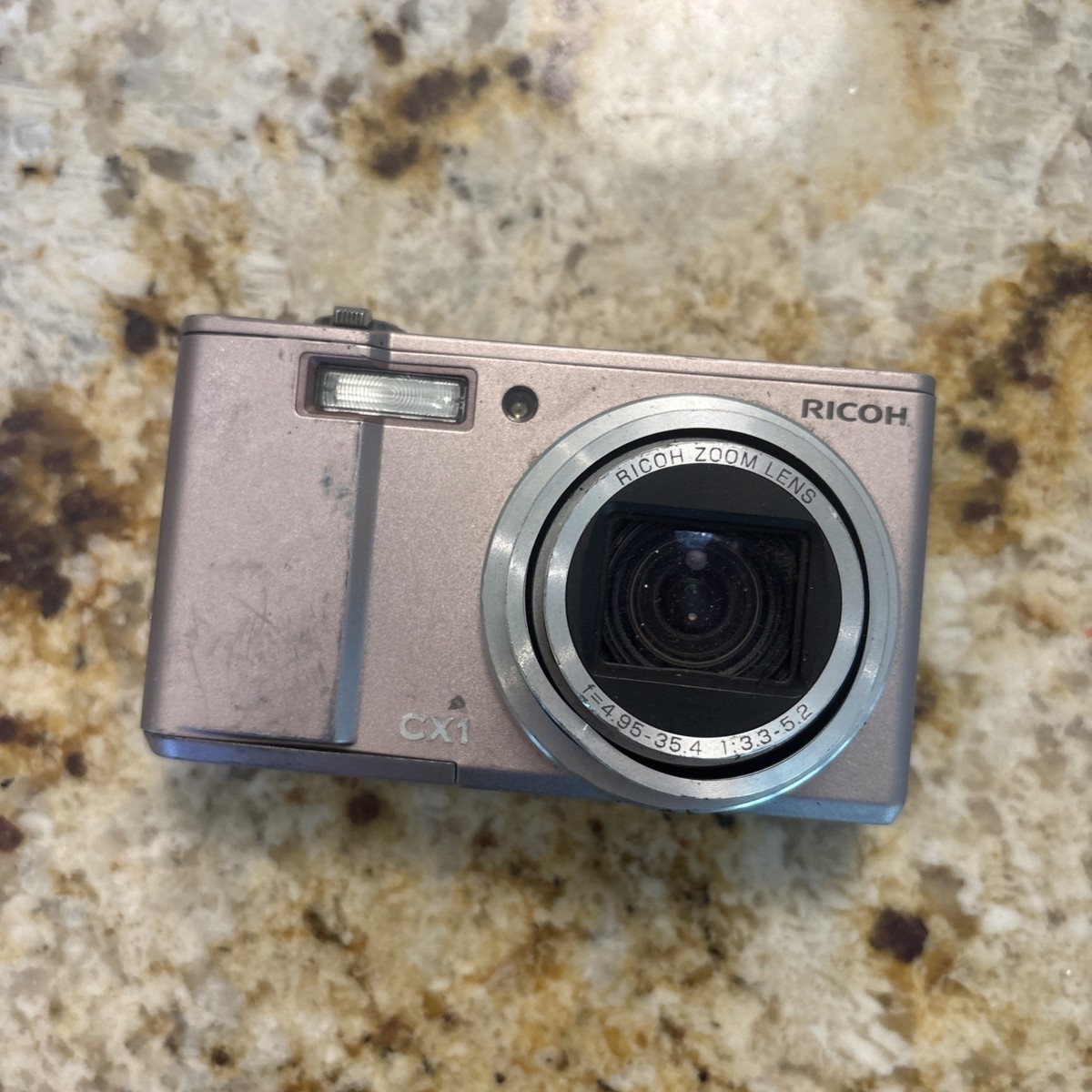 Ricoh CX1 Digital Compact Camera 7.1 Megapixels. PINK. STUCK LENS