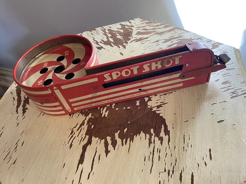 VINTAGE  TIN WOLVERINE SUPPLY PITTSBURGH PA SPOT SHOT TOY  Red