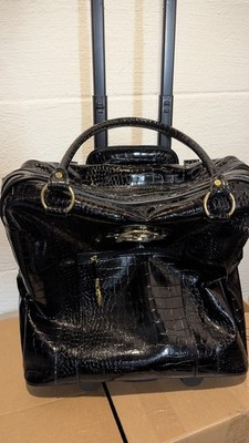 IMAN Rolling Carry on.  Black Croco with Hidden Handle.  Never Used Excellent