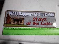 River's Edge Products Small Tin Sign- What Happens At The Cabin Stays...(18-070)